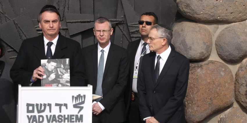 Brazilain President Jair Bolsonaro, left, with Israeli Tourism Minister Yariv Levin and Yad Vashem Director of External and Governmental Affairs Yossi Gevir at Yad Vashem Holocaust memorial in Jerusalem on April 2.
