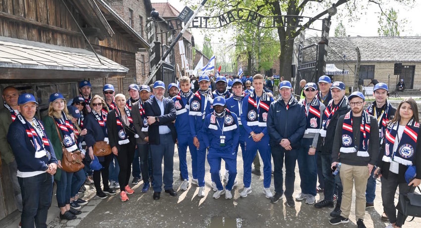 Players from the New England Revolution MLS team join the Chelsea players at Auschwitz on May 2.
