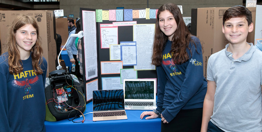Students from Hebrew Academy of the Five Towns and Rockaway showcase a device that alerts parents and cools a baby inadvertently left in a parked car.