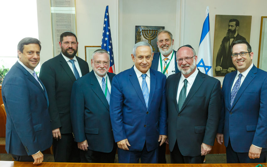 Israeli Prime Minister Benjamin Netanyahu is flanked by representatives of the Orthodox Union, including (left of Netanyahu) Executive Vice President Allen Fagin, of Woodmere, and (right of Netanyahu) OU President Moishe Bane of Lawrence.