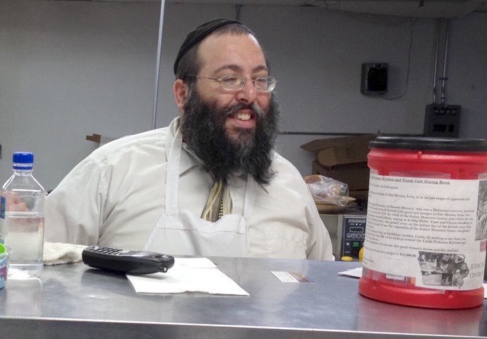 Rabbi Yossi Jacobson behind the counter of his Maccabees Kosher Deli in Des Moines, Iowa.