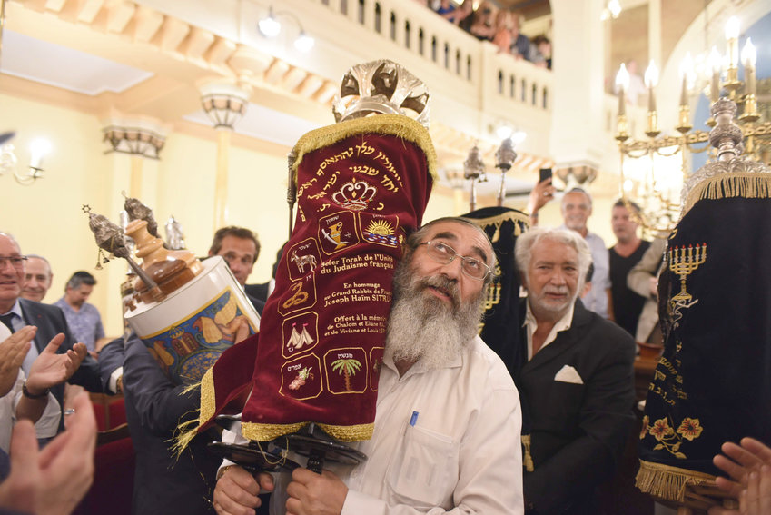 French Jews celebrating the inauguration of a new Torah scroll at the Grance Synagogue of Nice on July 11, 2019.