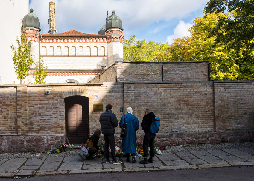 People mourn at the entrance to the Jewish synagogue on Oct. 10 in Halle, Germany.