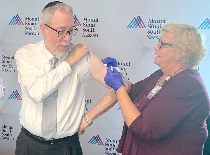 Rabbi Dr. Aaron Glatt got his flu vaccine last fall during a Mount Sinai South Nassau health event at the offices of The Jewish Star.