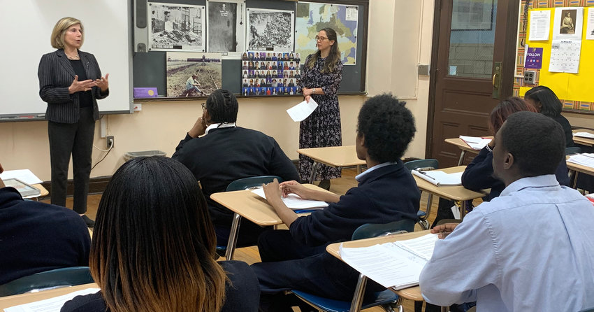 Amy Goldberg, left, and Lindsay Bressman talking to students at Bishop Loughlin Memorial High School in Brooklyn on Jan. 8.