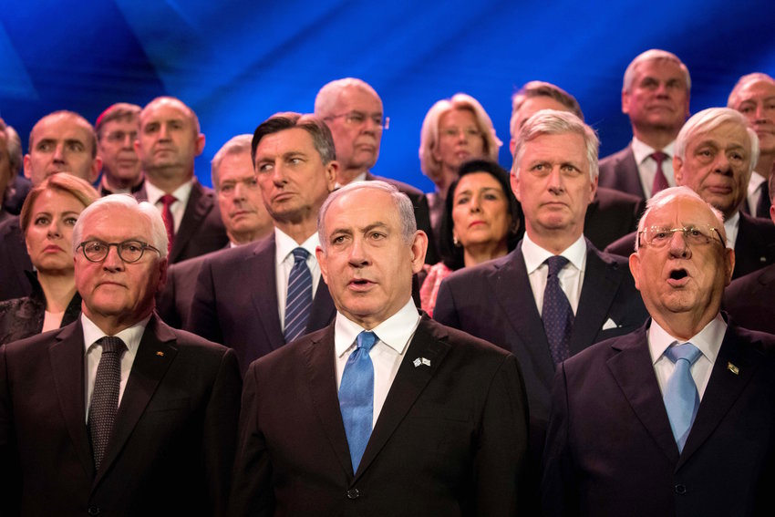 Israeli Prime Minister Benjamin Netanyahu and President Reuven Rivlin pose with world leaders during the Fifth World Holocaust Forum at the Yad Vashem Holocaust memorial museum in Jerusalem on Jan. 23. At left is German President Frank-Walter Steinmeier.