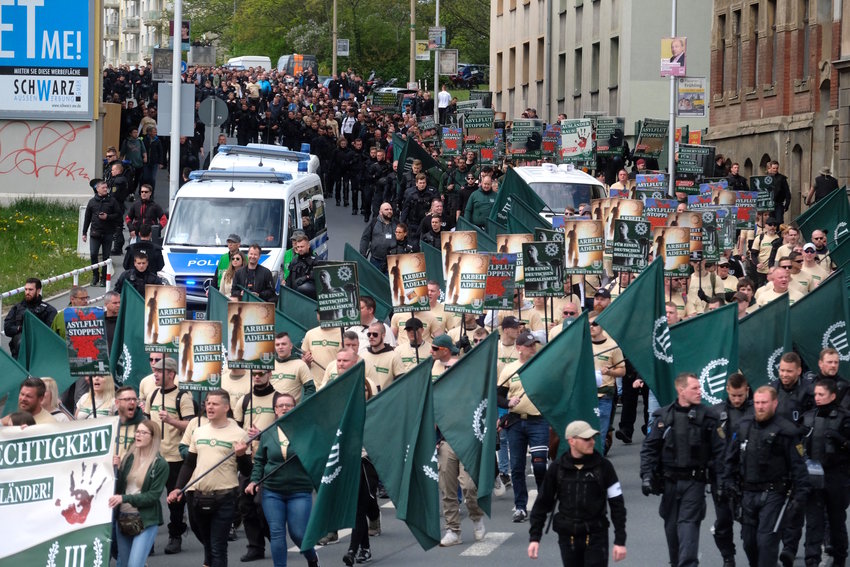 Supporters of the &quot;Der Dritte Weg/Der III Weg&quot; (The Third Path/The III Path) far-right and neo-nazi party walk through Plauen, eastern Germany, during a demonstration on Labour Day, May 1, 2019.