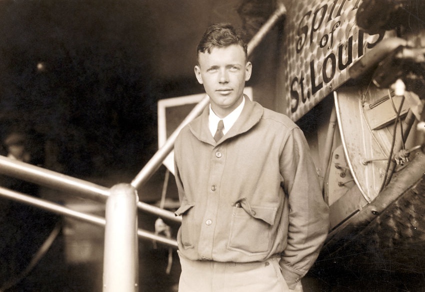 Charles Lindbergh (1902-1974) posing by the plane in which he completed the first nonstop solo flight across the Atlantic, the Spirit of St. Louis.
