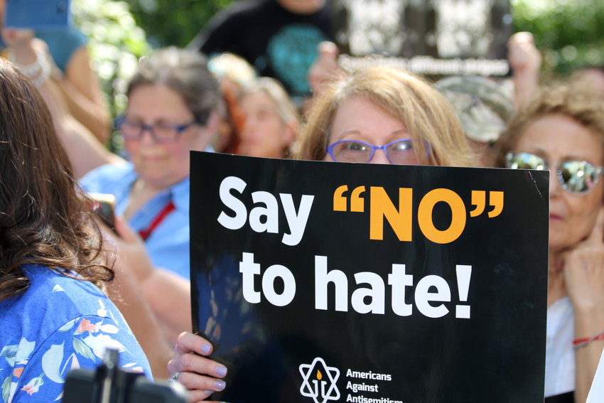 A woman holds a sign against anti-Semitism at a rally in New York on Sept. 22, 2019.