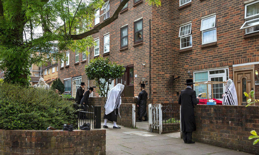 A prayer service outside a Stamford Hill home on April 25.