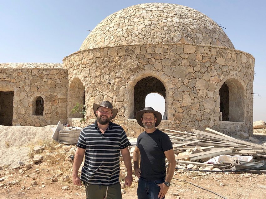 Ari Abramowitz (left) and Jeremy Gimpel in front of their house of worship on Arugot Farms.