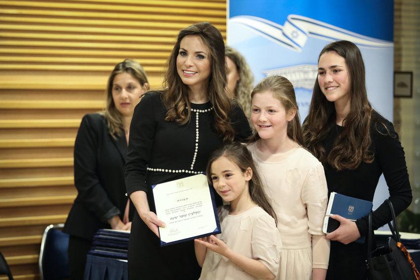 New Knesset member Omer Yankelevich poses for a picture with her family at the Knesset, on April 30, 2019.
