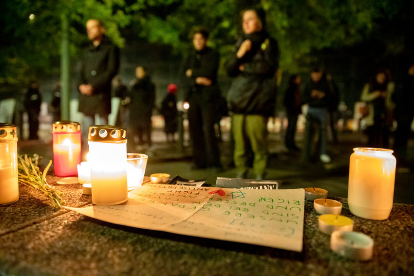 Participants in a solidarity demonstration in the aftermath of the killings in Halle stand before candles at the New Synagogue Berlin, on Oct. 9, 2019.
