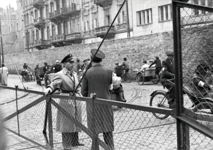 Jewish Ghetto Police guarding the gates of the Warsaw Ghetto, June 1942.