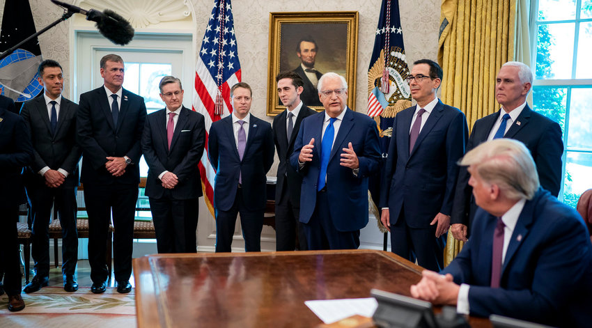 President Donald Trump listens as US Ambassador to Israel David Friedman speaks in the Oval Office last Friday, at the announcement that the Kingdom of Bahrain is joining the United Arab Emirates in normalizing relations with Israel.