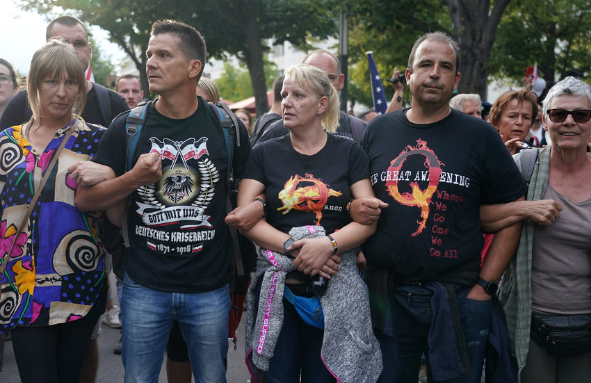 A group of Germans followers of the QAnon conspiracy theory protest in Berlin on Aug. 29, as German extremists inspired by QAnon stormed the country&rsquo;s parliament.