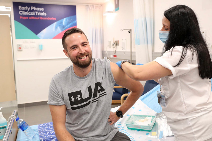 Nurse Hela Litwin administers Israel&rsquo;s first SARs-CoV-2 vaccine, BriLife, to volunteer Segev Harel at Sheba Medical Center at Tel Hashomer in Ramat Gan on Nov. 1.