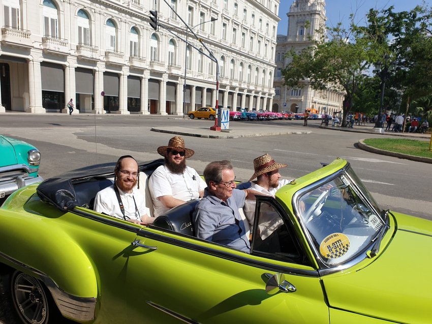 Saul Berenthal (front left), 75, was born and raised in Cuba but left for Miami in 1960, following the 1959 Castro revolution. He is pictured here in Havana, cruising around in a classic 1950s American-made car.