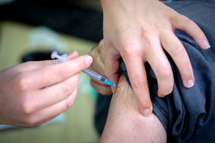 An Israeli receives a COVID-19 vaccine at the HMO Clalit&rsquo;s vaccination center in Jerusalem, on Dec. 23.