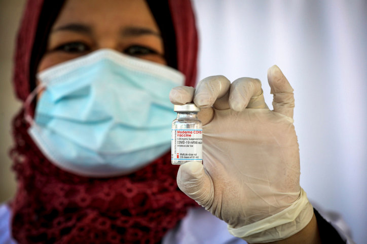 A Palestinian health worker holds a Covid-19 vaccine injection after the delivery of vaccine doses from Israel, at a Covid-19 vaccination center in the West Bank city of Bethlehem, on Feb. 3.