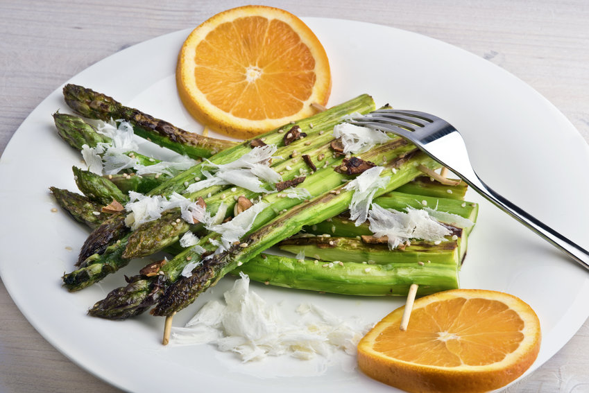 Sesame and garlic grilled asparagus rafts with parmesan shavings and orange.