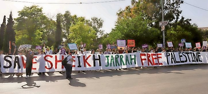 Protesters demonstrate against Israel&rsquo;s plan to evict the Arab tenants from Jewish-owned properties in the eastern Jerusalem neighborhood of Sheikh Jarrah, on May 28.