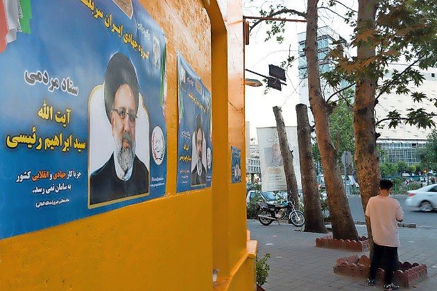Ebrahim Raisi Poster on a wall on a street in Tehran during the residential election.