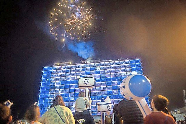 Israelis watch fireworks in Rabin Square in Tel Aviv, during a celebration of Israel's 73rd Independence Day.