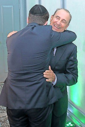 Bone marrow donor and recipient embrace for the first time, at the Ezer Mizion fundraiser. The two men will forever be intertwined.&nbsp;