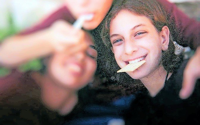 Malki Roth with friends, in a photograph found in a disposable camera after Malki was killed by the bomb set by Ahlam Tamimi at the Sbarro pizzeria in Jerusalem, on Aug. 9, 2001.