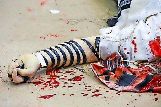 Gruesome scene of the Palestinian terrorist attack on worshipers in the Kehilat Yaakov synagogue in Jerusalem&rsquo;s Har Nof neighborhood on Nov. 18, 2014.
