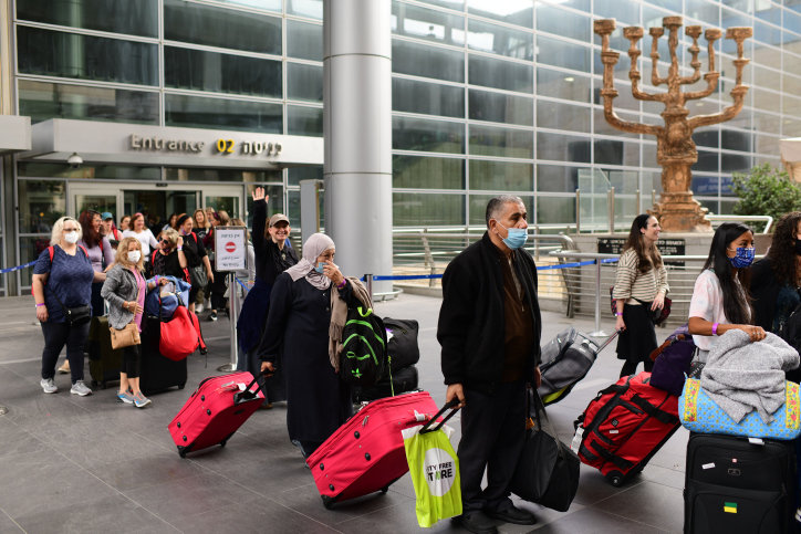 Travellers seen arriving at Ben Gurion International Airport, as Israel opens it borders and allow for tourists to enter the country, after months of keeping its borders closed for tourists flying in. on Nov. 1.