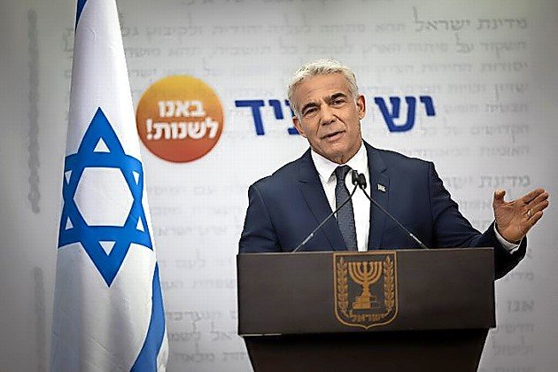Head of the Yesh Atid party Yair Lapid speaks during a faction meeting at the Knesset on Dec. 13, 2021.