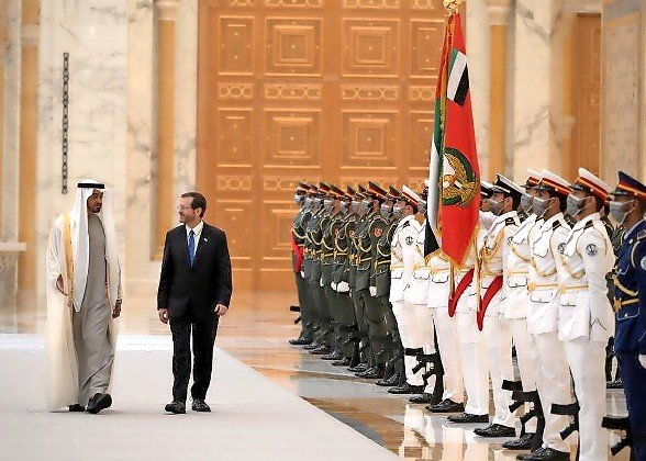 President Isaac Herzog walks with the Crown Prince of Abu Dhabi, Sheikh Mohammed bin Zayed Al Nahyan, at the royal palace in Abu Dhabi, UAE, on Sunday.