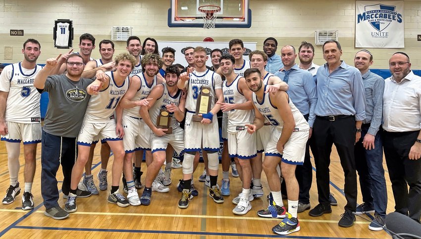 The 2021-2022 Skyline Conference champion Yeshiva University men&rsquo;s basketball team, pictured on Sunday.