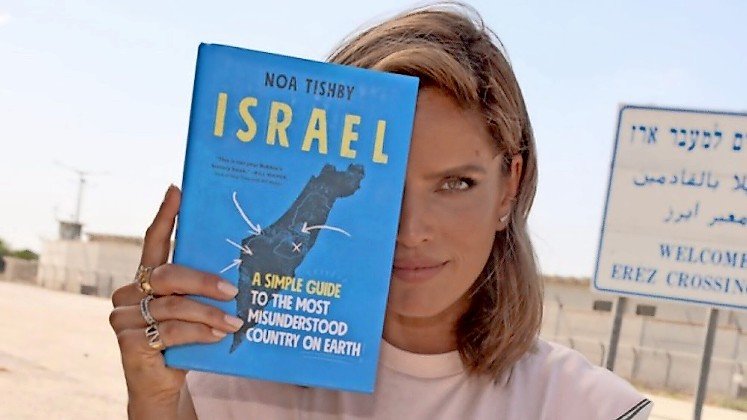 Noa Tishby, Israel&rsquo;s Special Envoy for Combating Antisemitism and Delegitimization of Israel, with her 2021 book, &ldquo;Israel: A Simple Guide to the Most Misunderstood Country on Earth.&rdquo;