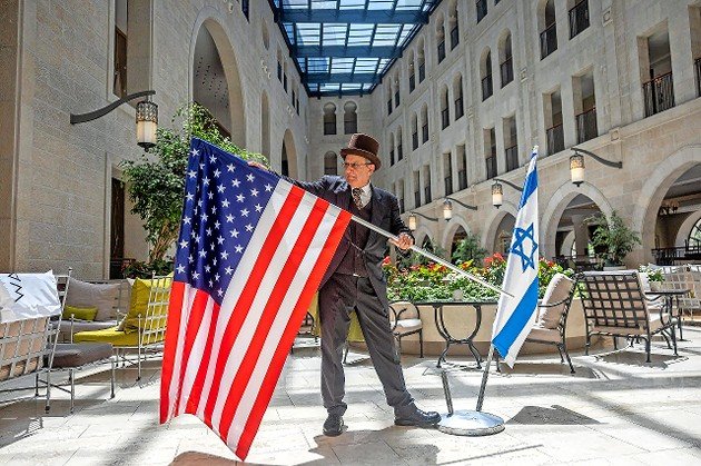 Workers at the Waldorf Astoria in Jerusalem prepare for a visit by President Joe Biden on July 12, 2022.