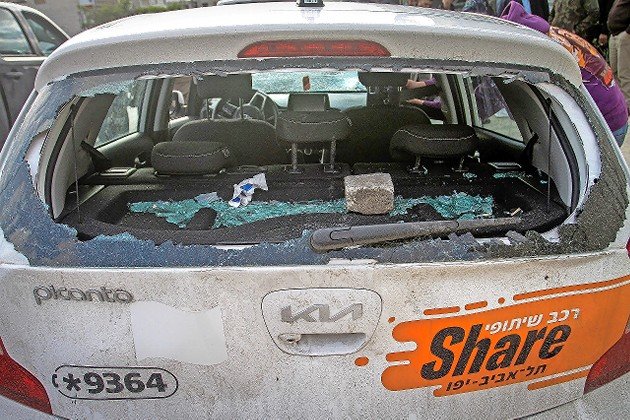 The smashed back window of a car driven by German tourists, attacked by Palestinian youth in Nablus in the West Bank on March 18.