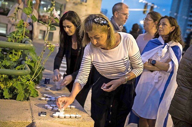 French Israelis light memorial candles at Paris Square in Jerusalem during a demonstration against anti-Semitism in France following the murder of Mireille Knoll in 2018.