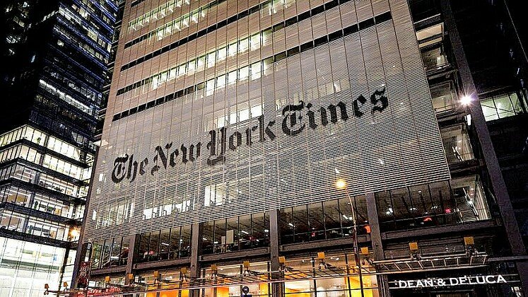 New York Times headquarters at night.