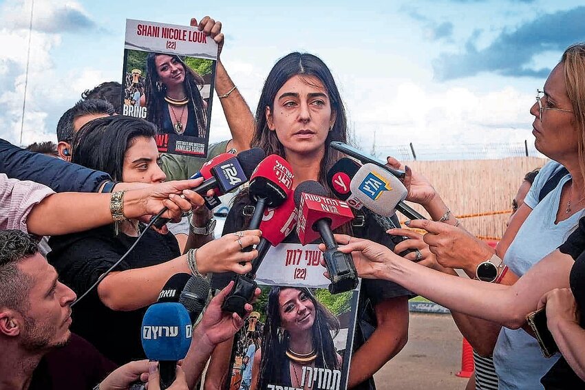 A cousin of Shani Louk, who was first thought abducted by Hamas terrorists in the attacks on Oct. 7 but later revealed to have been one of 1,200 people murdered that Saturday morning, speaks to the media outside the Home Front Command base in Ramla on Oct. 15.