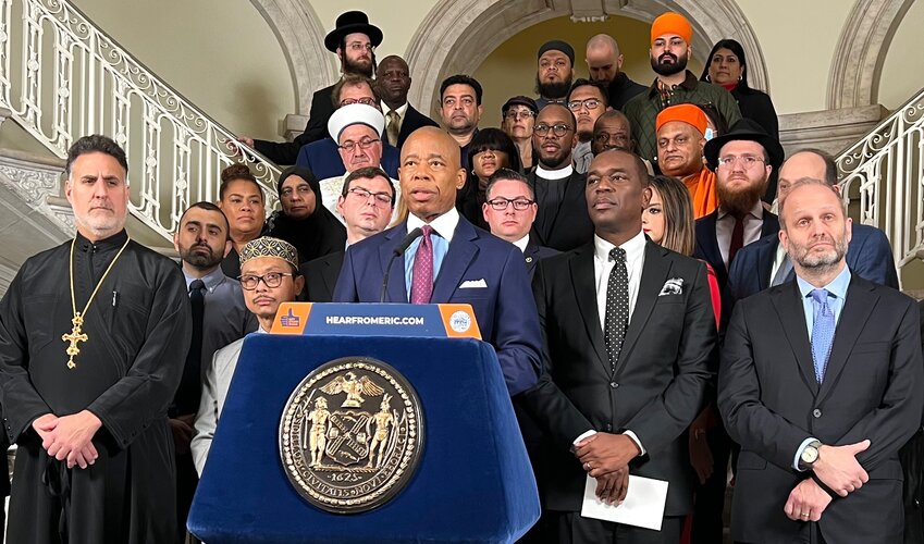 Mayor Eric Adams is flanked by leaders of various faiths at City Hall on the first day of Chanukah, Dec. 8. In front row from left: Archpriest Thomas P Zain of St. Nicholas Antiochian Orthodox Cathedral in Bay Ridge, Imam Shamsi Ali of the Jamaica Muslim Center, Mayor Adams, Pastor Gilford Monrose of the mayor's Office of Faith-Based and Community Partnerships, and Rabbi Chaim Steinmetz of Congregation Kehilath Jeshurun on the Upper East Side.