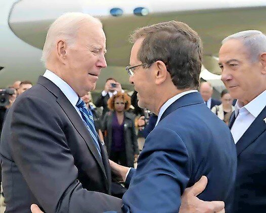 President Joe Biden is greeted by Israeli President Isaac Herzog and Prime Minister Benjamin Netanyahu upon his arrival at Ben-Gurion International Airport on Oct. 18.