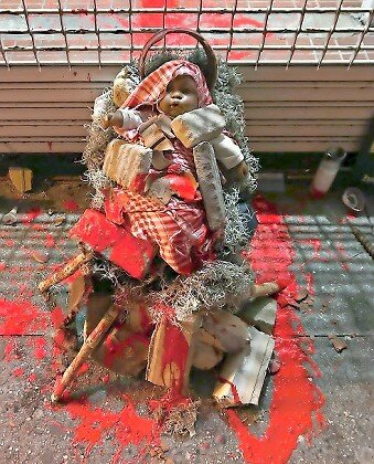 The &ldquo;blood&rdquo;-splattered doll-in-rubble that was left at Rep. Ritchie Torres&rsquo; office in the Fordham section of the Bronx.