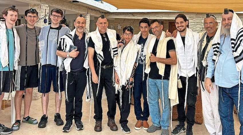 From left: SAR students Jason Kwalwasser, Sean Shteingart and Noah Marks, with some of the few remaining Orthodox Jewish men in Cuba.