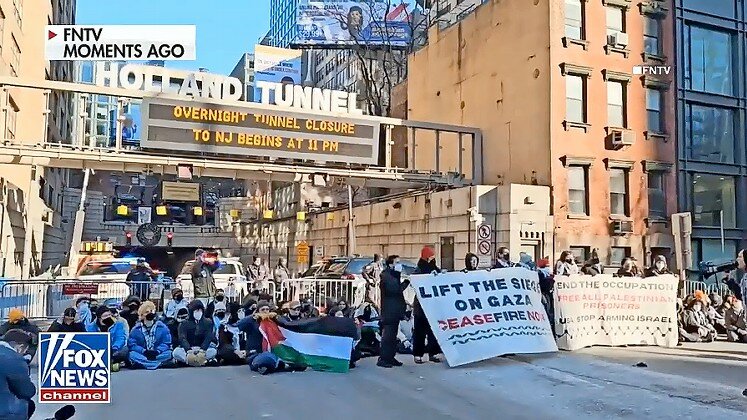 Pro-Palestinian demonstrators block the Holland Tunnel between Manhattan and New Jersey, Jan. 8, 2023.