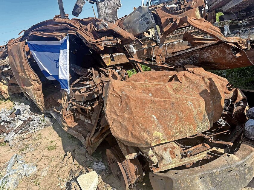 Wrecked cars from attendees of the Nova music festival piled up as a gruesome reminder.