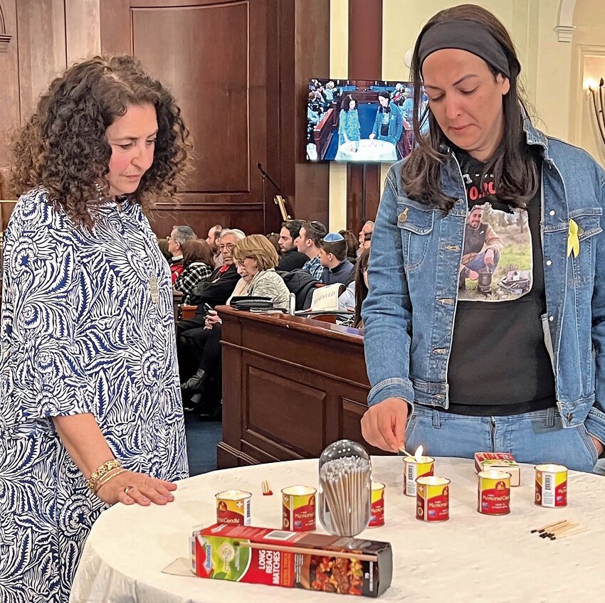 Sharon Fogel accompanies Einav Danion, mother of Ori, a 24-year-old hostage, who lit a seventh candle.