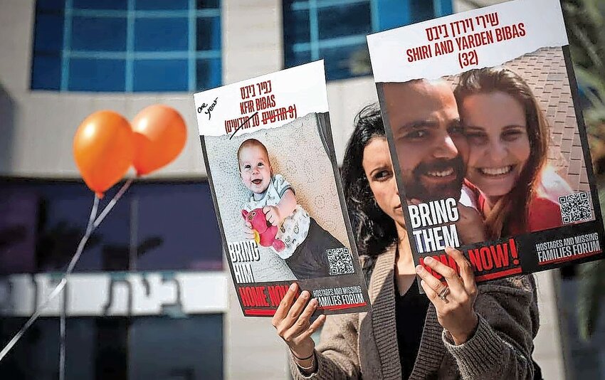 Israelis call for the release of hostages held captive in Gaza, outside the Red Cross offices in Tel Aviv, on Jan. 18.