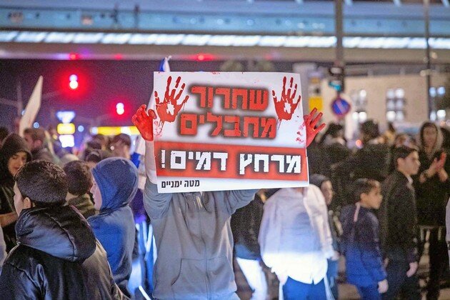 Demonstrators protest against the current hostage deal, at the entrance to Jerusalem on Jan. 16.